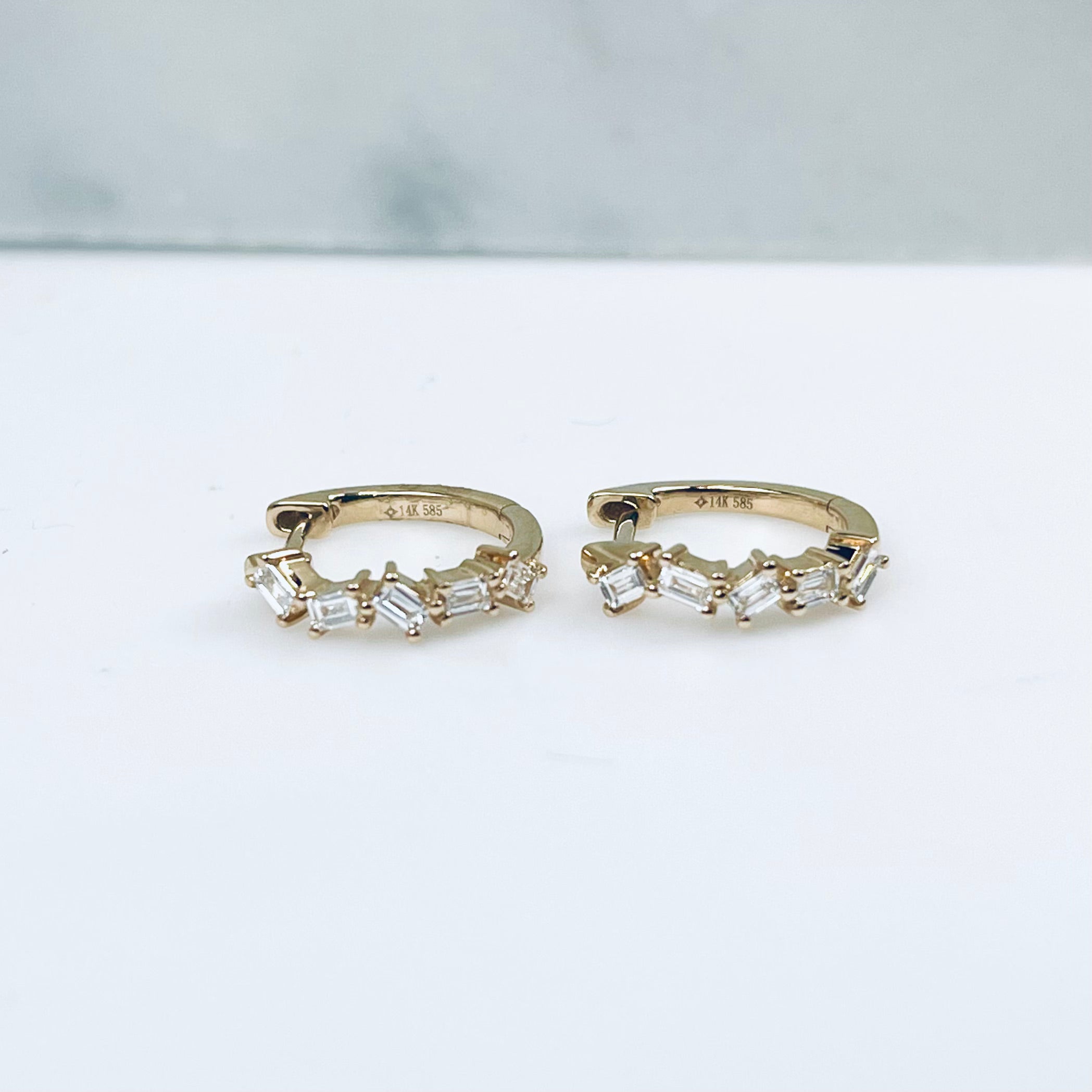 WD972 14kt gold huggie with baguette diamond hoops