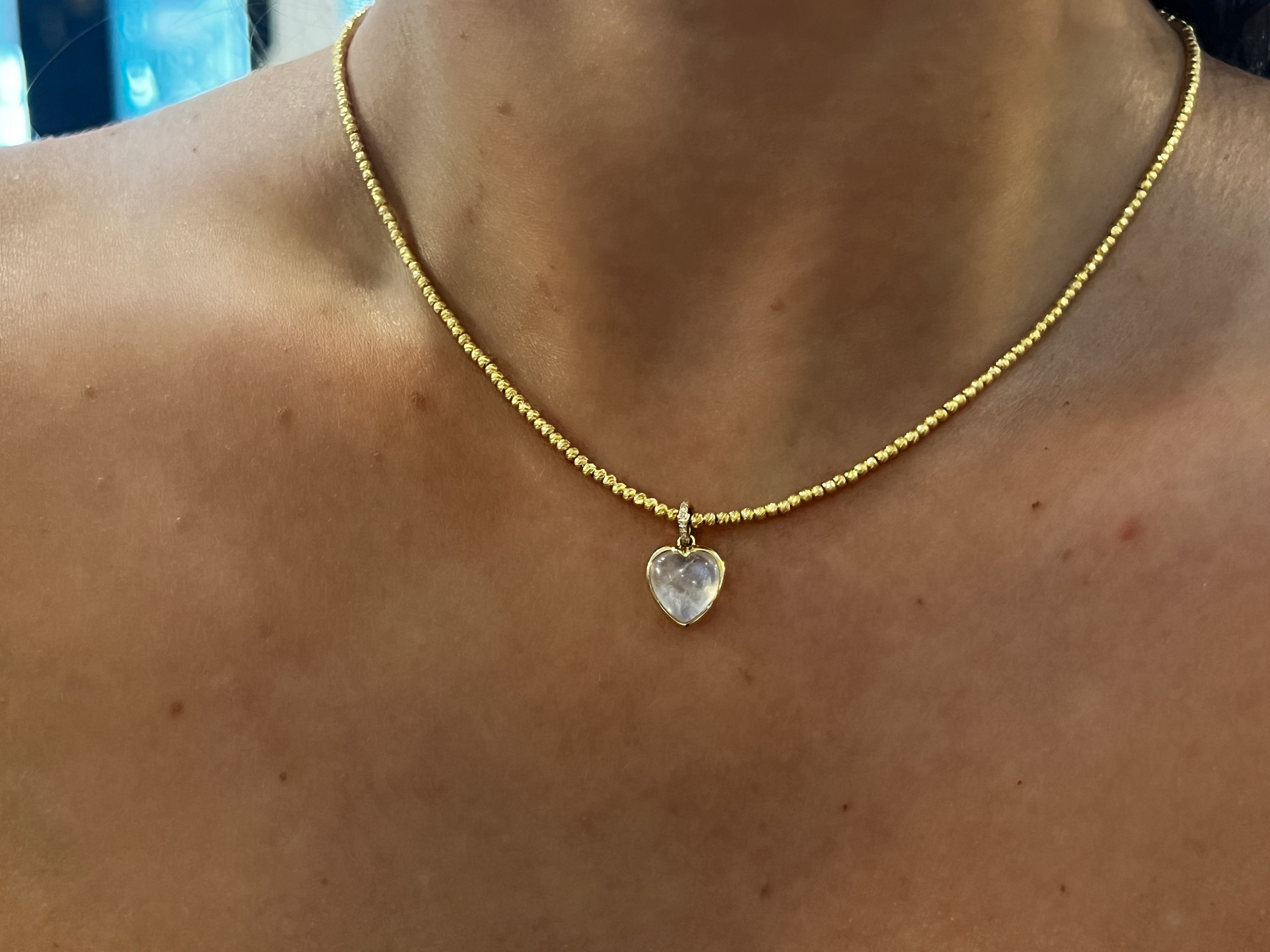 WD1826 14kt gold moonstone with diamond detail heart pendant
