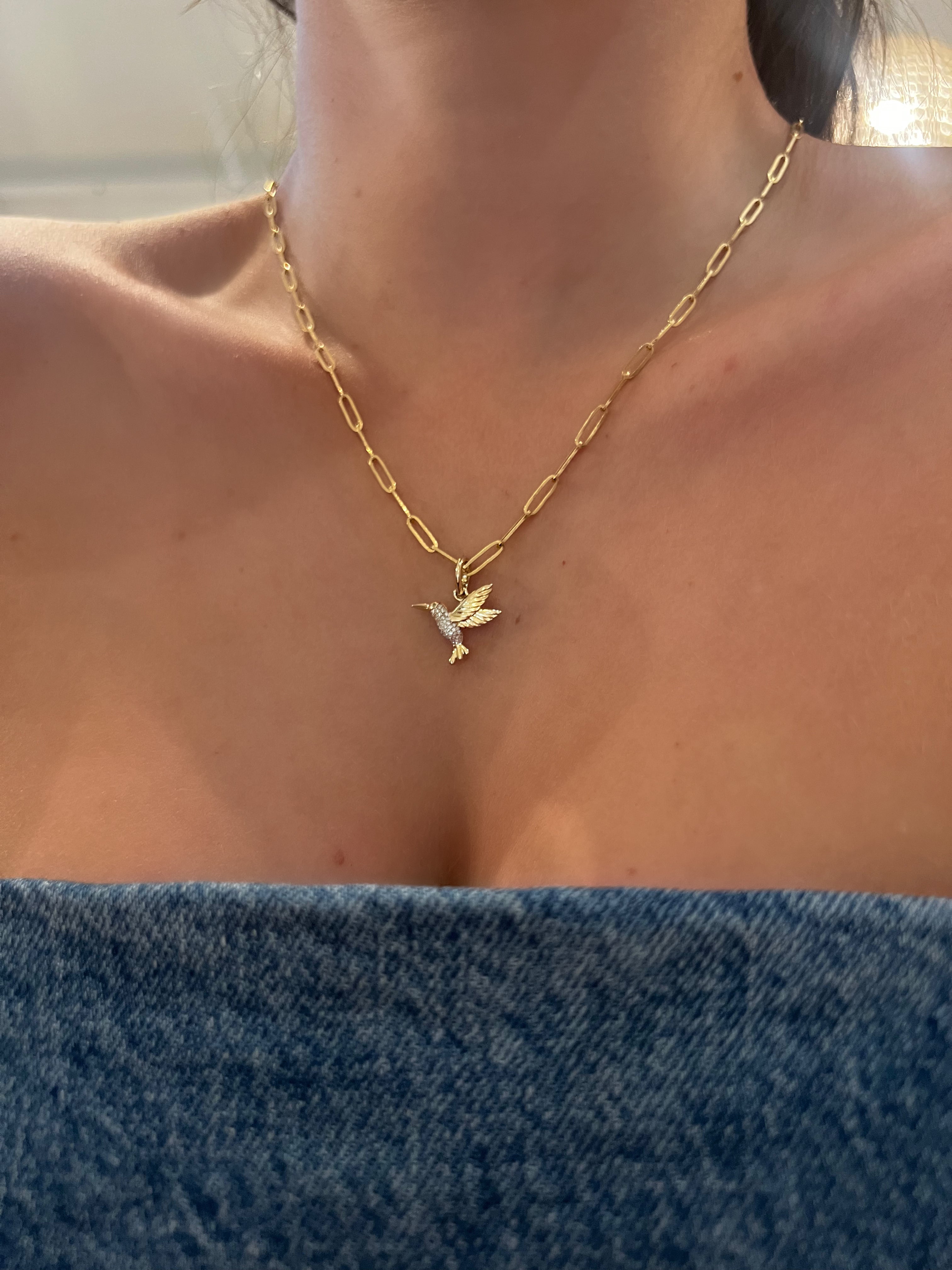 WD1823 14kt gold Pave set diamond humming bird with emerald eye pendant